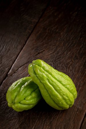 Fresh chayote fruits on the table.
