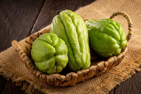 Fresh chayote fruits on the table.