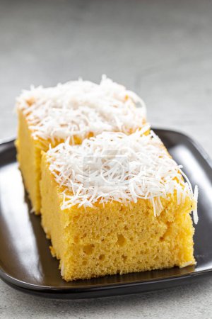 Photo for Sliced coconut cake on the table - Royalty Free Image