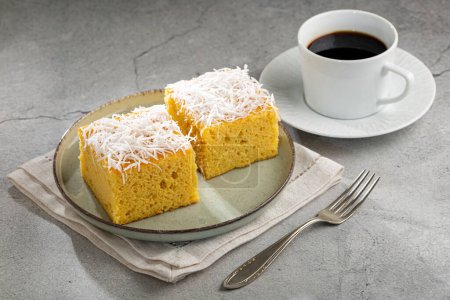 Photo for Sliced coconut cake on the table - Royalty Free Image