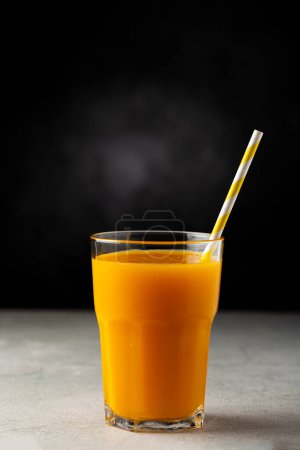 Photo for Mango juice in glass cup on the table. Mango smoothie. - Royalty Free Image