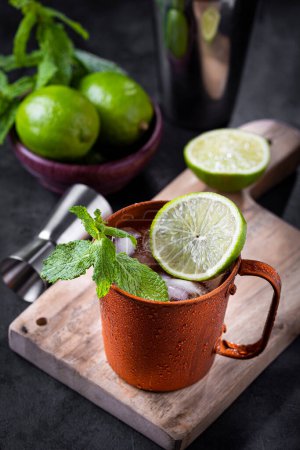 Photo for Moscow mule cocktail in copper mug on the table. - Royalty Free Image