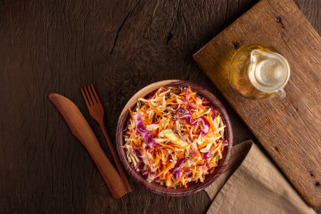 Photo for Coleslaw salad with white cabbage, red cabbage and sliced carrots - Royalty Free Image