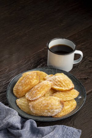 Traditional madeleines with sprinkled sugar.