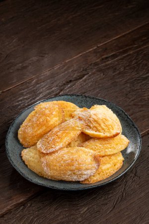 Photo for Traditional madeleines with sprinkled sugar. - Royalty Free Image