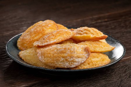 Traditional madeleines with sprinkled sugar.