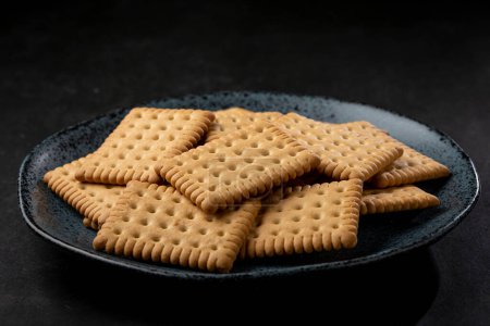 Photo for Plate with cornstarch biscuit on the table. - Royalty Free Image