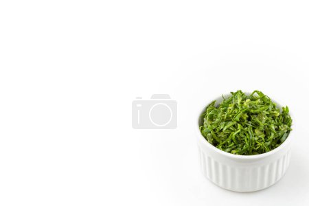 Kale sliced in ramekin isolated on white background
