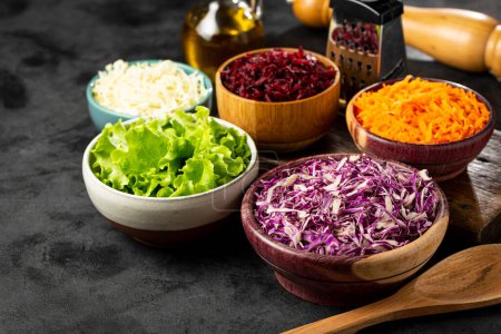 Photo for Fresh grated vegetables in bowls on the table. Healthy food. - Royalty Free Image