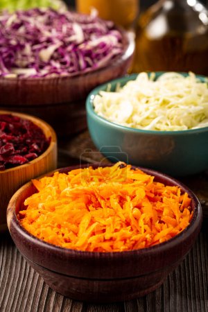 Photo for Fresh grated vegetables in bowls on the table. Healthy food. - Royalty Free Image