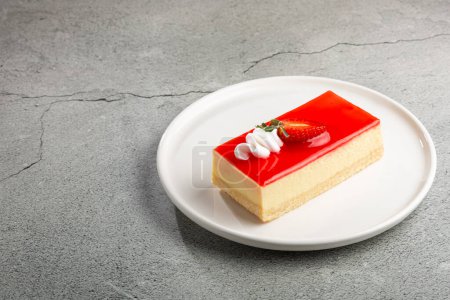 Photo for Slice of cheesecake with strawberry topping. - Royalty Free Image