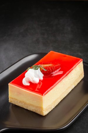 Photo for Slice of cheesecake with strawberry topping. - Royalty Free Image