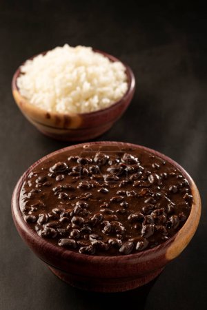 Photo for Black beans and rice in wooden bowl. - Royalty Free Image