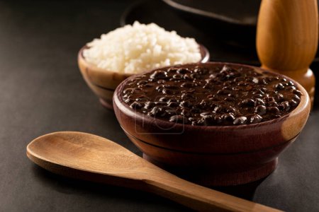 Photo for Black beans and rice in wooden bowl. - Royalty Free Image