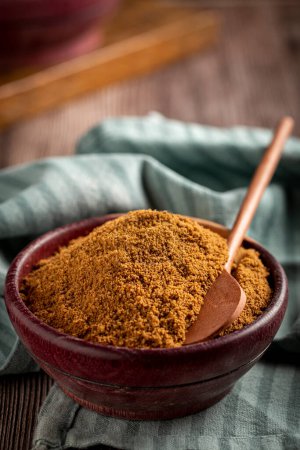 Photo for Brown sugar in wooden bowl on the table. - Royalty Free Image