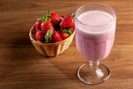 Photo for Glass with tasty strawberry smoothie. - Royalty Free Image