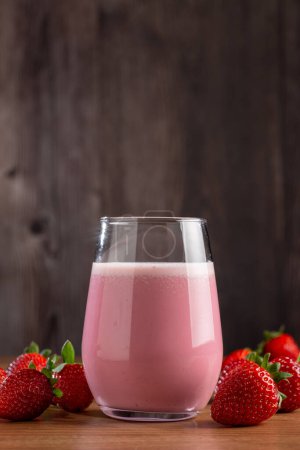 Photo for Glass with tasty strawberry smoothie. - Royalty Free Image