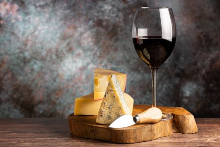 Photo for Cheese board with a glass of red wine. - Royalty Free Image
