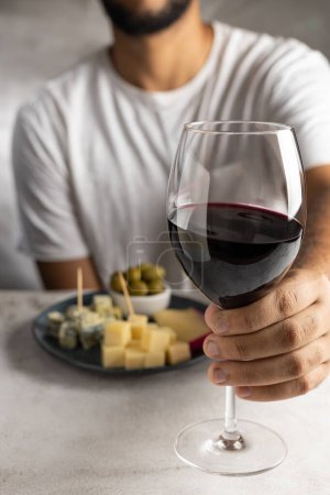 Photo for Man tasting wine and cheese. - Royalty Free Image