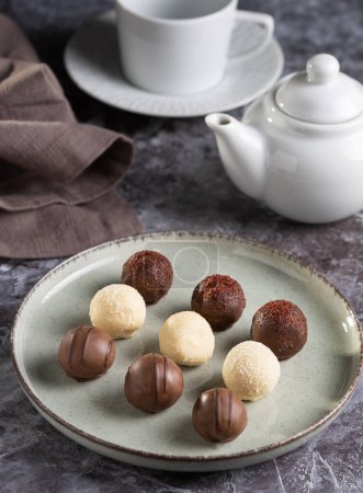 Delicious chocolate truffles on the table.