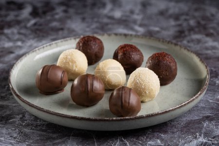 Delicious chocolate truffles on the table.