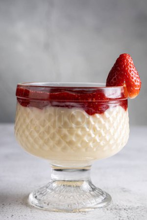 Photo for Dessert of creamy pudding and strawberry jam. Panna cotta. - Royalty Free Image