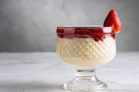 Photo for Dessert of creamy pudding and strawberry jam. Panna cotta. - Royalty Free Image