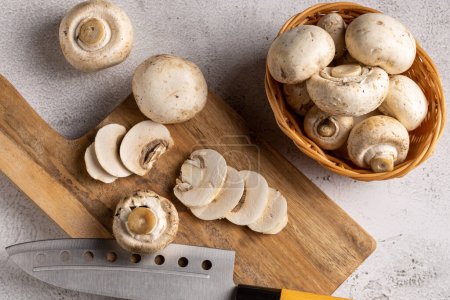 Photo for Fresh sliced mushrooms on the table. - Royalty Free Image