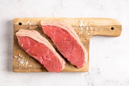 Photo for Raw picanha steak on the cutting board. - Royalty Free Image