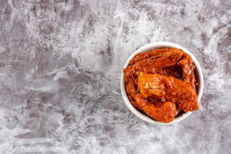 Photo for Sun dried tomatoes with herbs. - Royalty Free Image