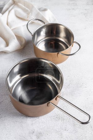 Photo for Set of cookware on the table. Metallic pans. - Royalty Free Image