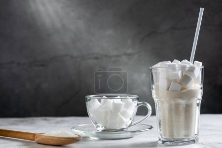 Photo for White sugar cubes in clear glass cups. - Royalty Free Image