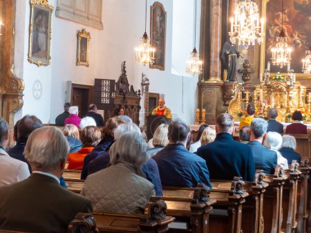 Neulengbach, Austria - March 31, 2024: people on the Easter mess in the local church