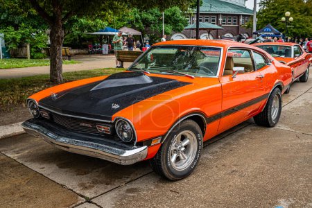 Photo for Des Moines, IA - July 01, 2022: High perspective front corner view of a 1974 Ford Maverick Grabber Coupe at a local car show. - Royalty Free Image