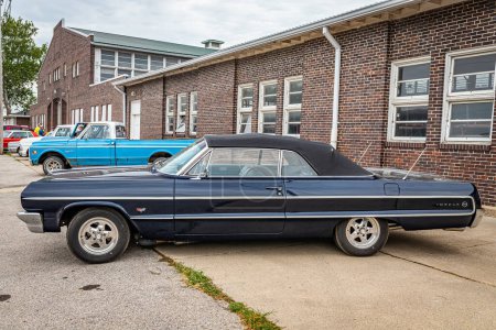 Photo for Des Moines, IA - July 01, 2022: High perspective side view of a 1964 Chevrolet Impala Convertible at a local car show. - Royalty Free Image
