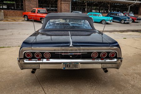 Photo for Des Moines, IA - July 01, 2022: High perspective rear view of a 1964 Chevrolet Impala Convertible at a local car show. - Royalty Free Image