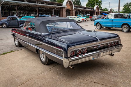 Photo for Des Moines, IA - July 01, 2022: High perspective rear corner view of a 1964 Chevrolet Impala Convertible at a local car show. - Royalty Free Image