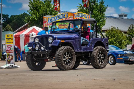 Photo for Des Moines, IA - July 03, 2022: Wide angle front corner view of a 1970 Willys Jeep CJ5 at a local car show. - Royalty Free Image