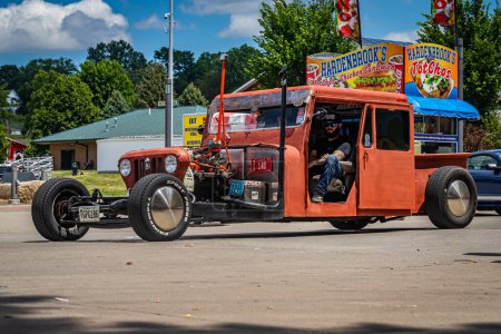 Photo for Des Moines, IA - July 03, 2022: Wide angle front corner view of a Custom 1975  Willys Jeep Rat Rod at a local car show. - Royalty Free Image