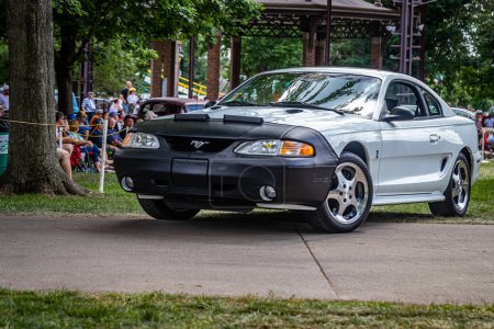 Photo for Des Moines, IA - July 03, 2022: Low perspective front corner view of a 1998 Ford Mustang SVT Cobra at a local car show. - Royalty Free Image