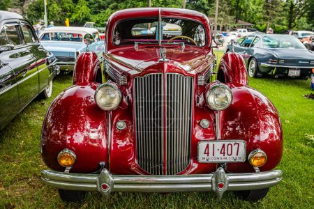Photo for Iola, WI - July 07, 2022: High perspective front view of a 1938 Packard 1601-D Touring Sedan at a local car show. - Royalty Free Image