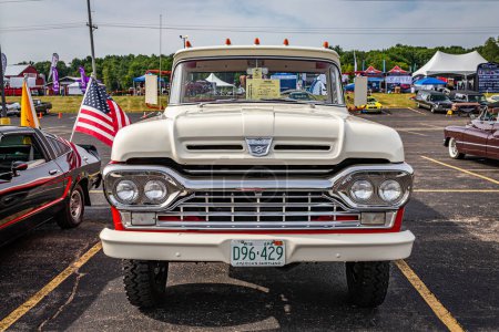 Photo for Iola, WI - July 07, 2022: High perspective front view of a 1960 Ford F-250 Styleside Pickup Truck at a local car show. - Royalty Free Image