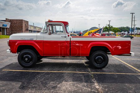 Photo for Iola, WI - July 07, 2022: High perspective side view of a 1960 Ford F-250 Styleside Pickup Truck at a local car show. - Royalty Free Image