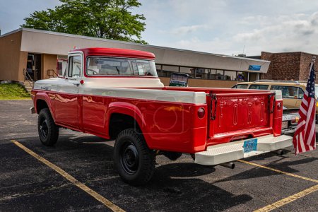 Photo for Iola, WI - July 07, 2022: High perspective rear corner view of a 1960 Ford F-250 Styleside Pickup Truck at a local car show. - Royalty Free Image