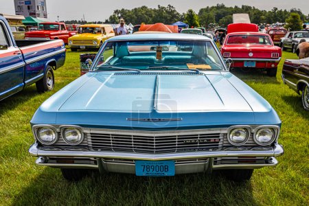 Photo for Iola, WI - July 07, 2022: High perspective front view of a 1965 Chevrolet Impala SS 2 Door Sedan at a local car show. - Royalty Free Image