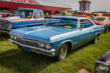 Photo for Iola, WI - July 07, 2022: High perspective front corner view of a 1965 Chevrolet Impala SS 2 Door Sedan at a local car show. - Royalty Free Image