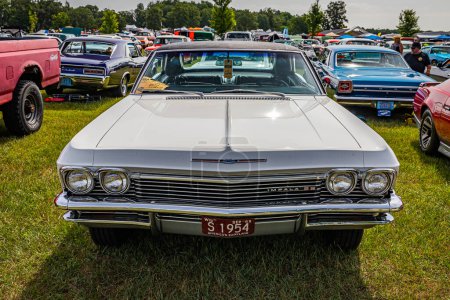 Photo for Iola, WI - July 07, 2022: High perspective front view of a 1965 Chevrolet Impala SS 2 Door Hardtop at a local car show. - Royalty Free Image