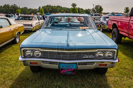 Photo for Iola, WI - July 07, 2022: High perspective front view of a 1966 Chevrolet BelAir 4 Door Sedan at a local car show. - Royalty Free Image