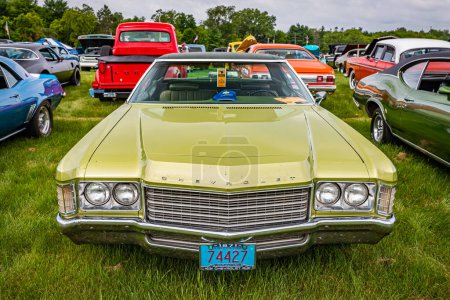 Photo for Iola, WI - July 07, 2022: High perspective front view of a 1971 Chevrolet Impala 2 Door Hardtop at a local car show. - Royalty Free Image