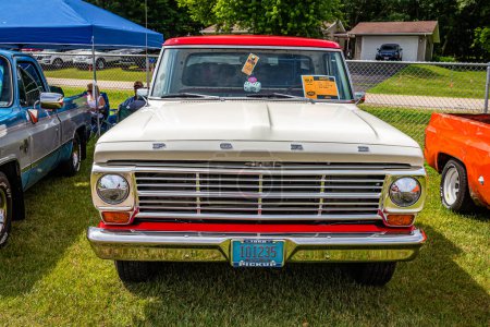 Photo for Iola, WI - July 07, 2022: High perspective front view of a 1968 Ford F250 Camper Special Pickup Truck at a local car show. - Royalty Free Image